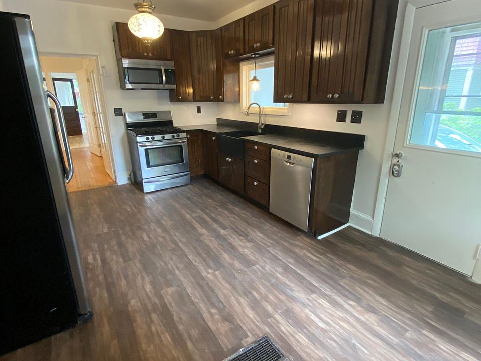 Eat in Kitchen with Soapstone counters and farm sink