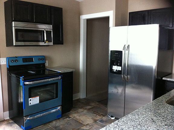 Kitchen with door to basement in view