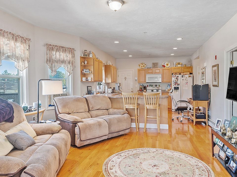 Living room with kitchen in background
