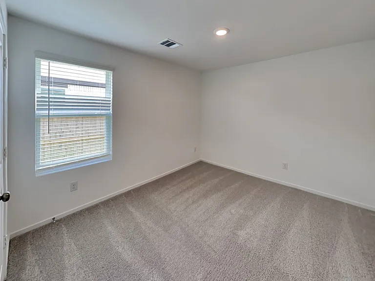 Spacious, well-lit room with n