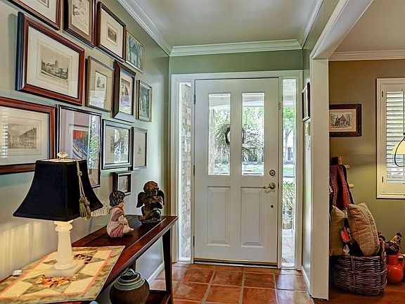 The large, covered patio with its beautiful stamped concrete creates an amazing outdoor living space.  The beautifully landscape