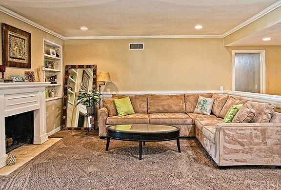 Living Room with cozy fireplace and recessed lighting
