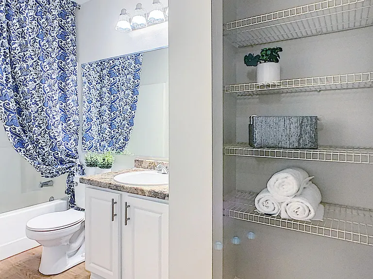 Indulge in spa-like luxury in our master bathrooms, featuring a large shower/tub combination and a spacious linen closet.