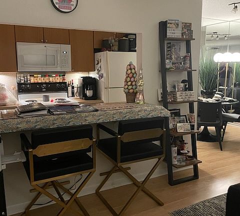 Looking towards the breakfast bar that's open to the kitchen from the living room