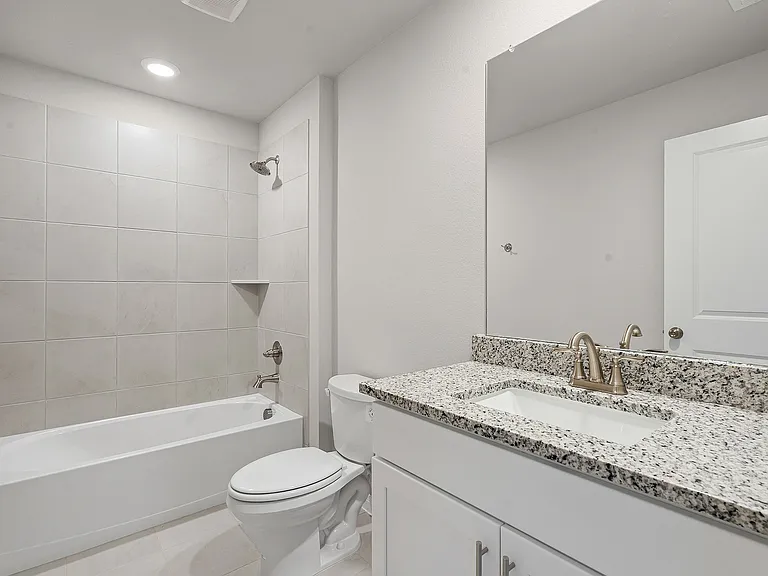 Bathroom with mirror and tub