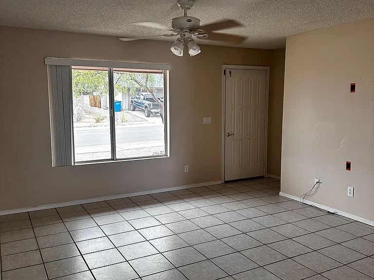 Living room area, walking in from garage