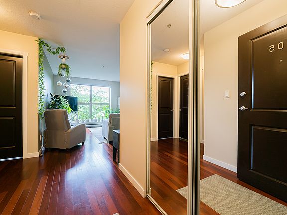 You see the bright Livingroom and second bedroom from the entry.