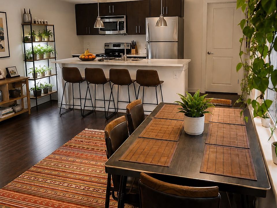 Open-plan kitchen, breakfast bar, and living room.