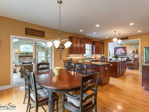 BREAKFAST AREA IS SPACIOUS, STEPS TO YOUR OUTSIDE AND SUNROOM