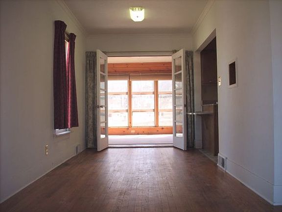 Dining room with french doors to sun room.