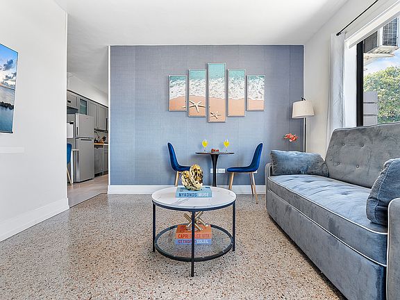 Living room with lots of comfy seating and large smart TV