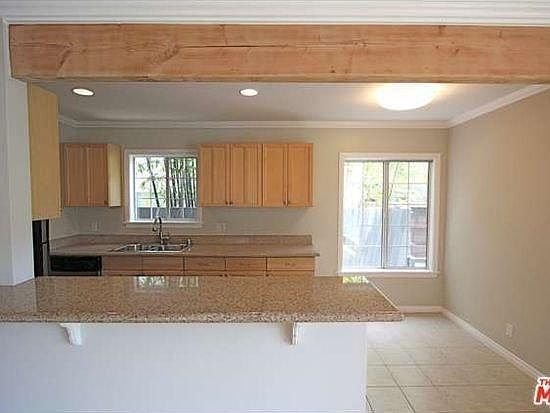 Eat-in kitchen with laundry area. Room for small table and chairs.