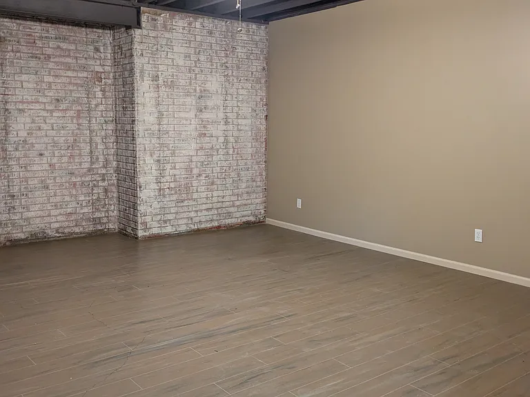 Lower-level flex room, perfect for a media room.