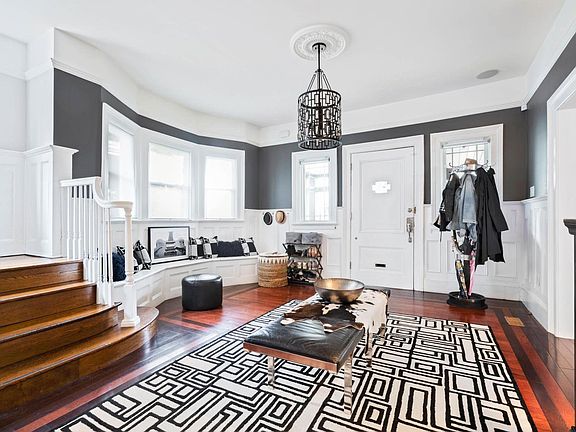 Gorgeous & grand entryway/foyer with coat & media closets.