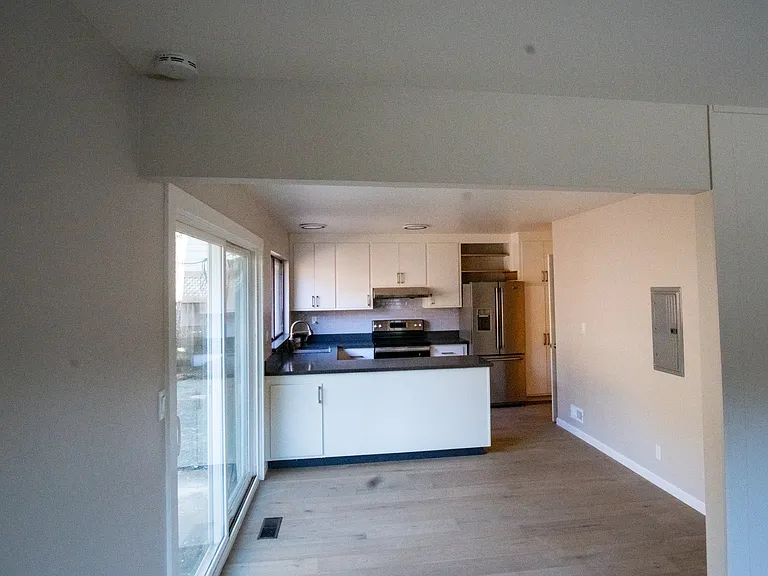 Dining area with kitchen pinnula and access to outdoor patio