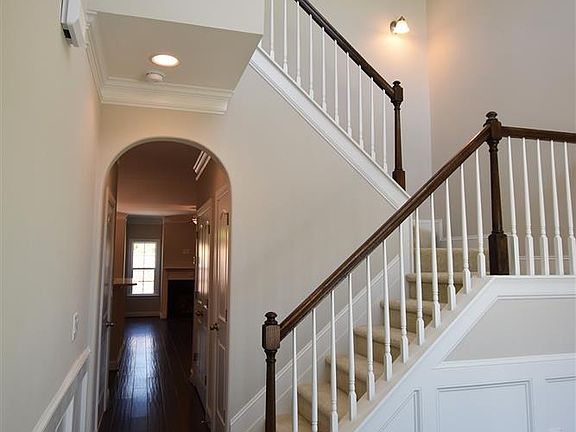 Two-story foyer with wainscoting