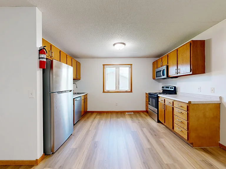 Kitchen with all stainless steel appliances
*Not shown in photo: new base cabinets and countertop in progress
