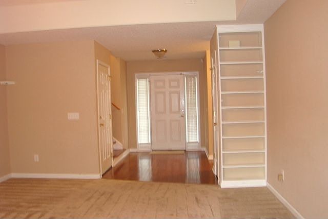 View towards front door. Built-ins in Great Room. Nice storm door 