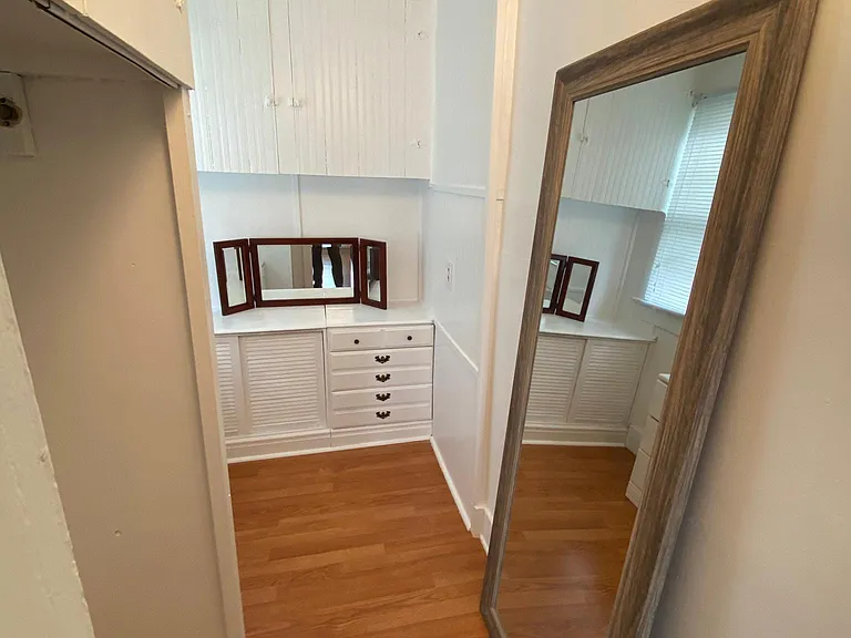 The walk-in closet floor mirror and vanity mirror