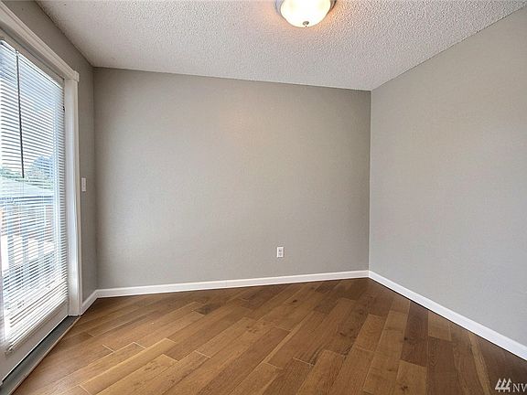 Eating area off of kitchen has lots of natural light and french doors lead out to the deck.