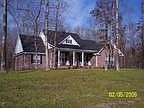 Wooded lot with a beautiful lakeview from the front porch.