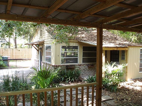 covered back porch showing extra house and controlled access gate