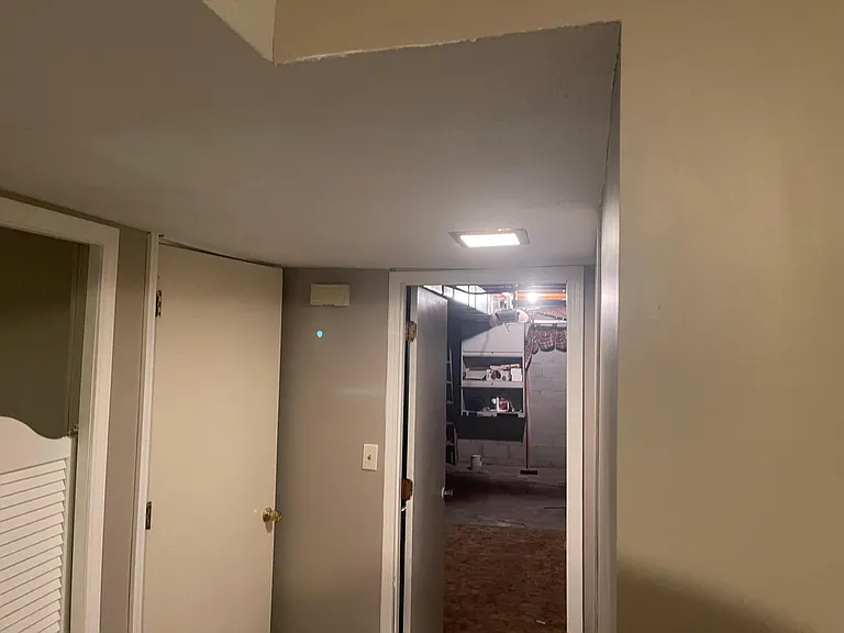 Entrance to garage, storage, and laundry from basement.