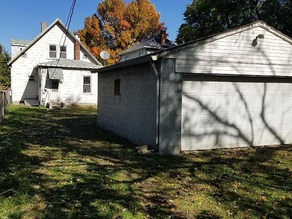Back view with detached garage
