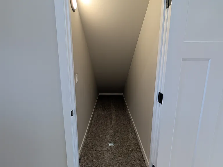 Downstairs stairwell storage.