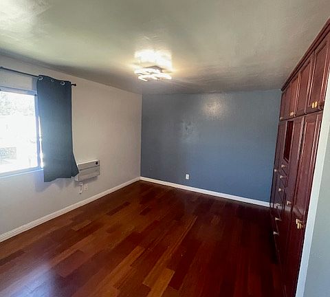 Primary bedroom with a custom closet