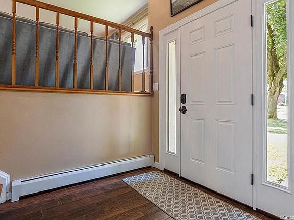 The entrance has an inviting high ceiling.