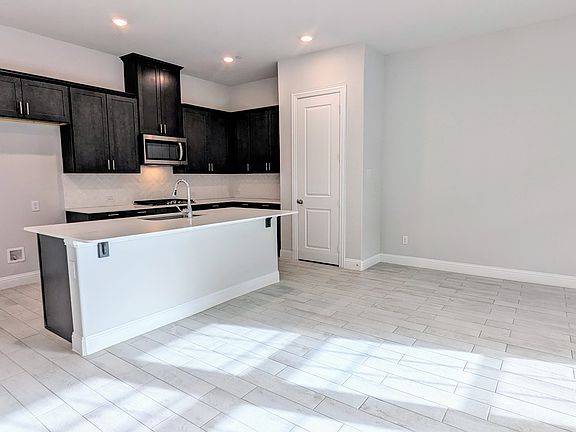 Luxury kitchen featuring stainless appliances and gas cooktop. Now includes stainless refrigerator, not pictured
