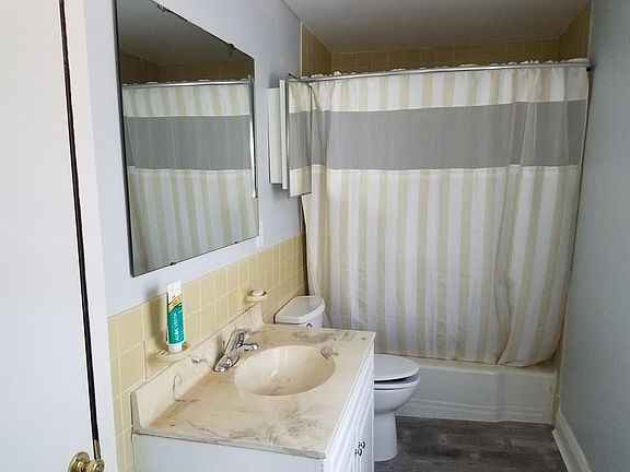 Bathroom with tub and shower and large closet.