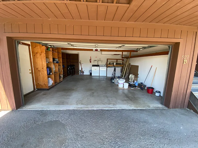 Unit A tenant shares Unit B Garage (pictured); Unit A tenant receives access to garage including washer/dryer and right half for parking/storage.