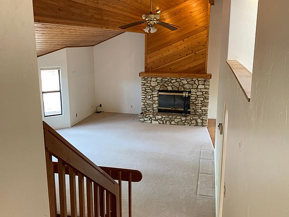 View of living room from upper level in this tri-level home