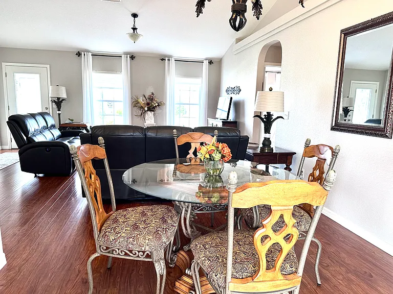 dining area off of the screened in porch