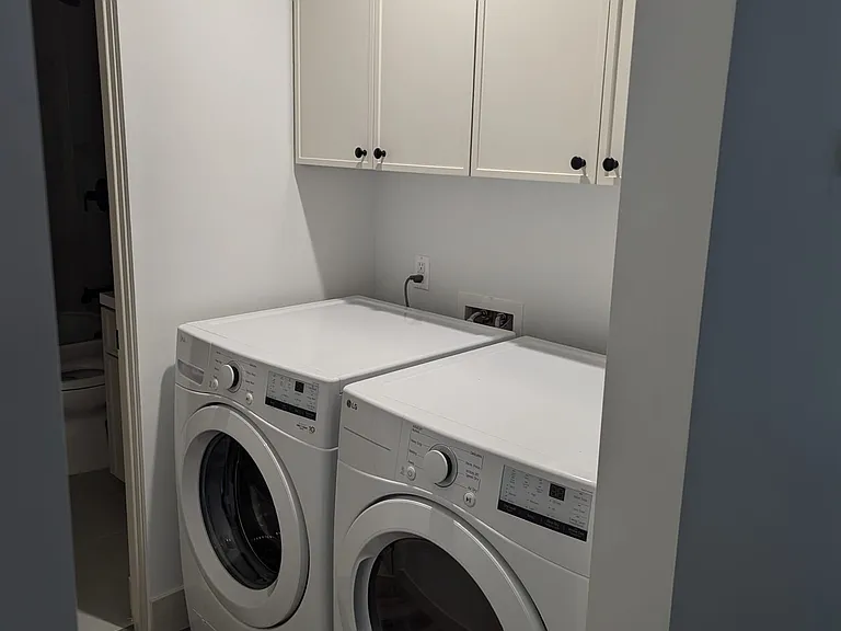 view from the all into the laundry room/ bathroom