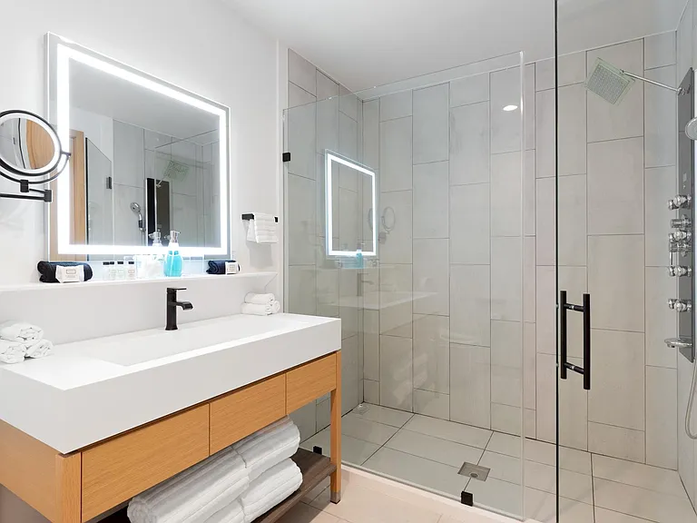 LED-lit vanity mirrors and spacious rain shower to leave you feeling refreshed