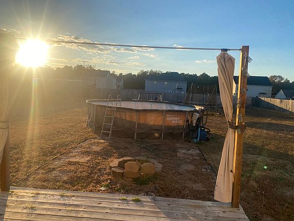 Backyard; pool available, trampoline, swing set