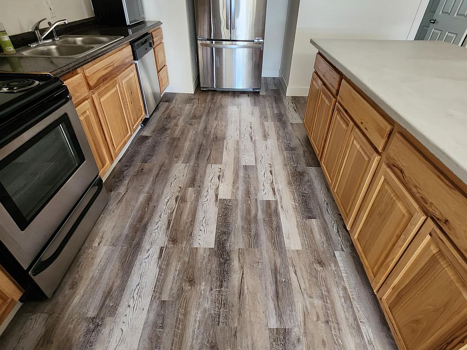 Full kitchen with stainless appliances, concrete counter