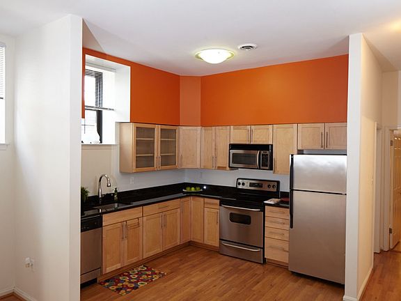 Granite, stainless steel appliance and plenty of light