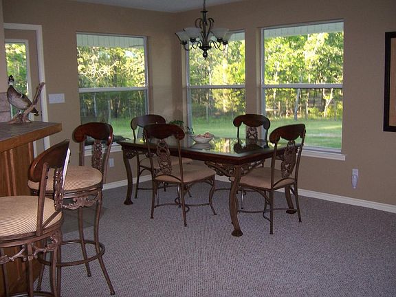 Dining overlooks large yard