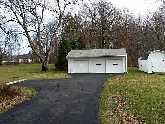 3 car garage with heater (possible workshop), storage barn, drive filled and sealed 10/2016. Beautiful acreage with ample parking.