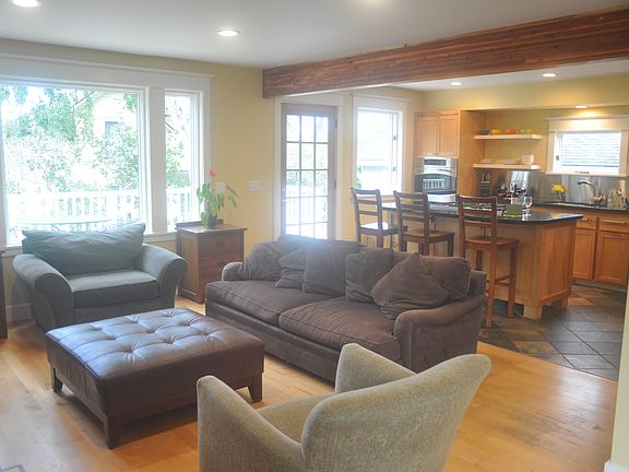Light filled living room and kitchen. (Home is unfurnished)
