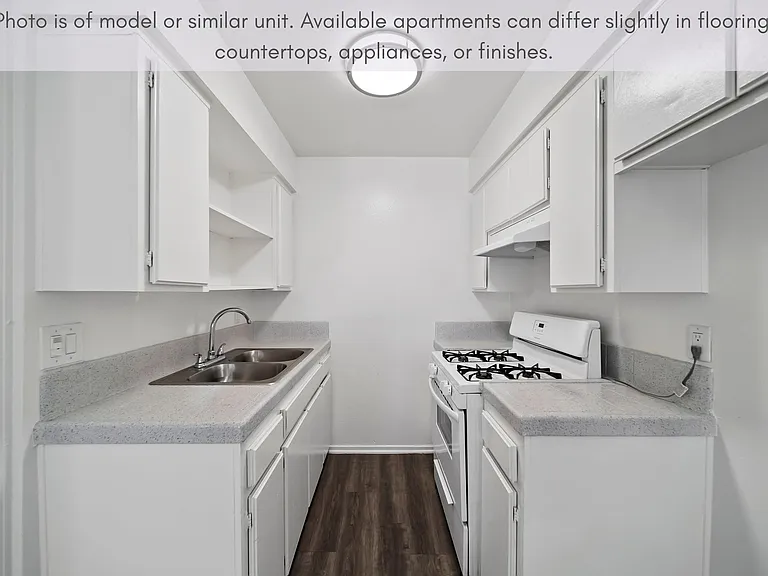 Efficient galley-style kitchen with generous cabinet storage and a clean, functional design.