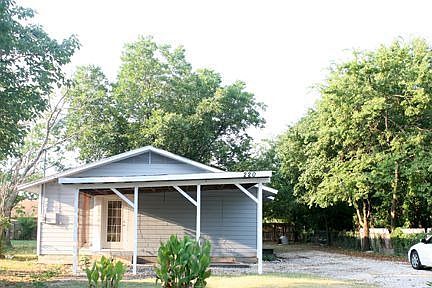 Carport side of home seen from street