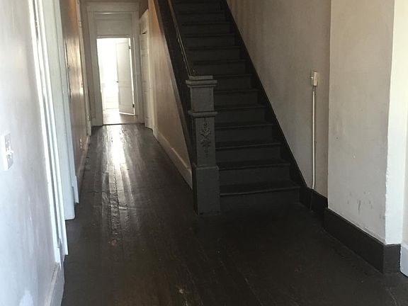Just inside front door is large staircase with tons of room.