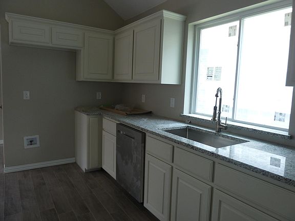 Kitchen - deep stainless sink, designer pull down faucet