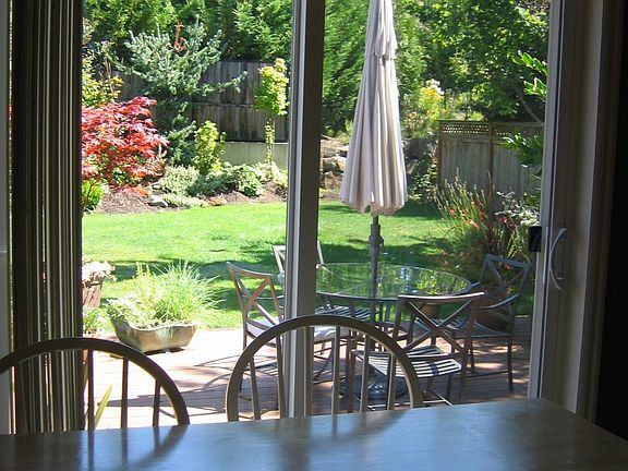 View to backyard from breakfast nook/kitchen.