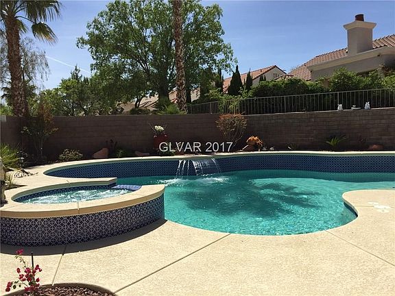 INGROUND HEATED POOL/SPA ... COOL DECK .... WATERFALL ... SURROUNDED BY GORGEOUS LANDSCAPING